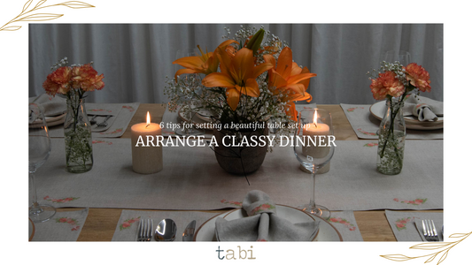 Tabi - An inviting table adorned with candles and flowers, enhancing the ambiance for a memorable dining experience.