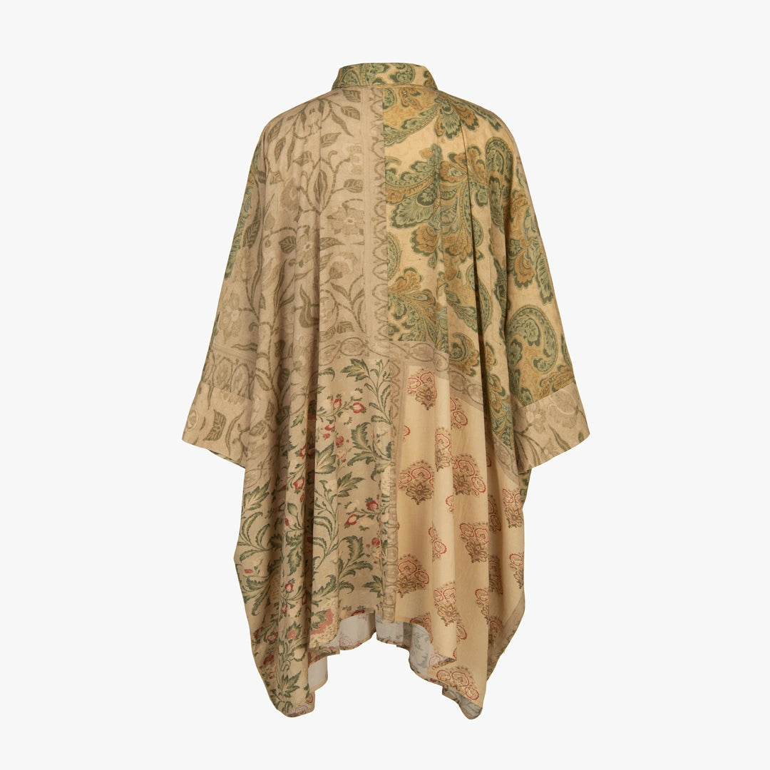 Beige floral patterned shawl on a white background