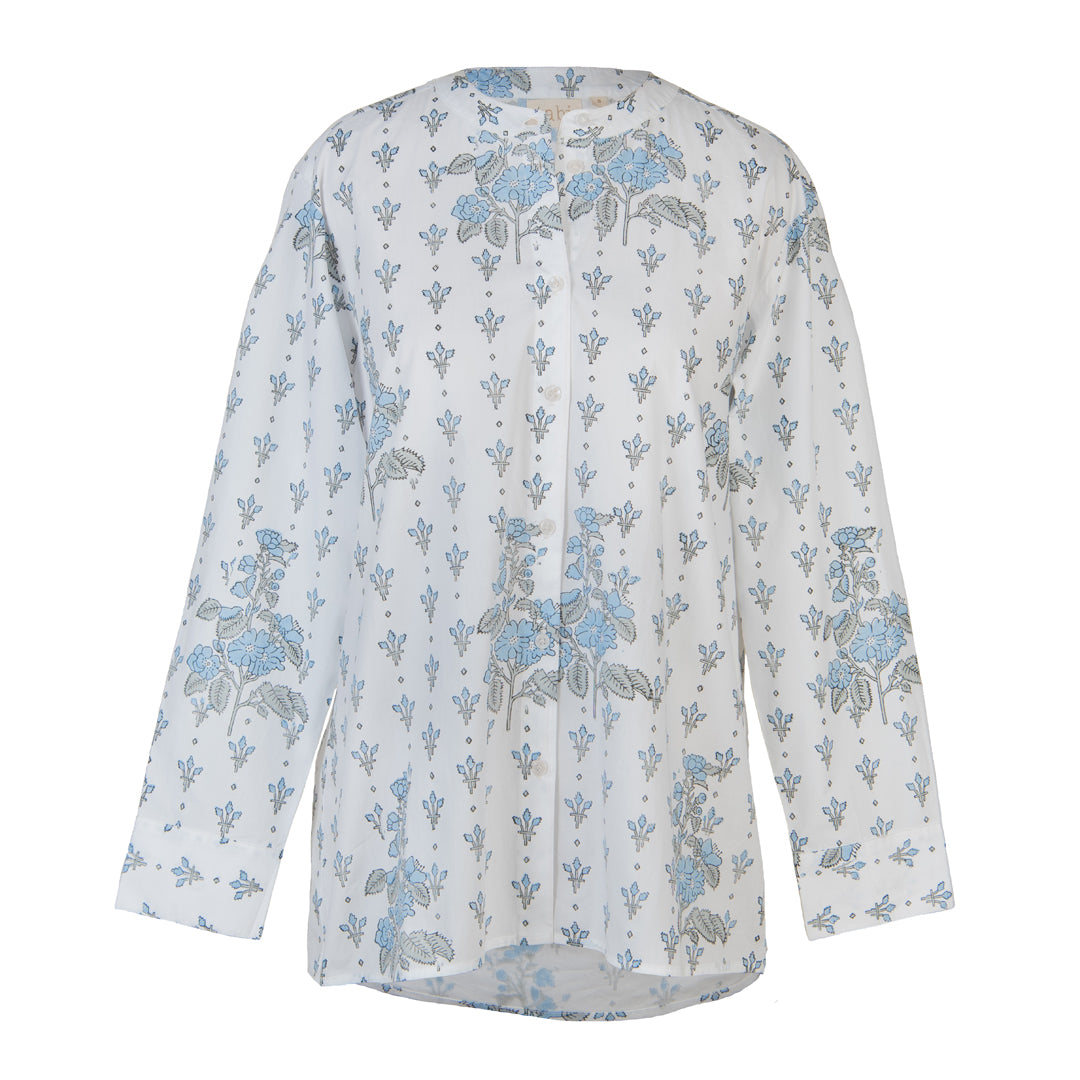 White blouse with blue floral pattern on a white background