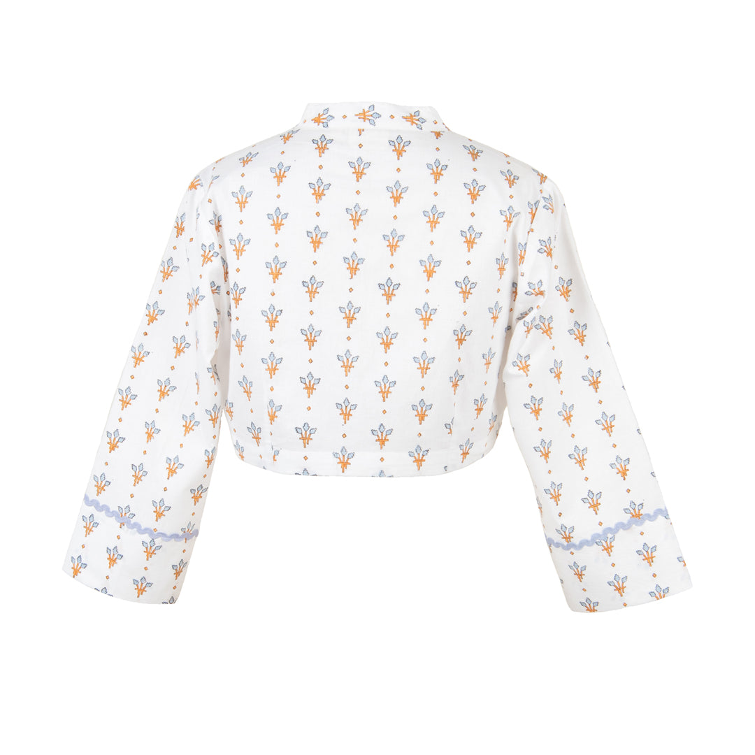 White crop top with floral pattern on a white background