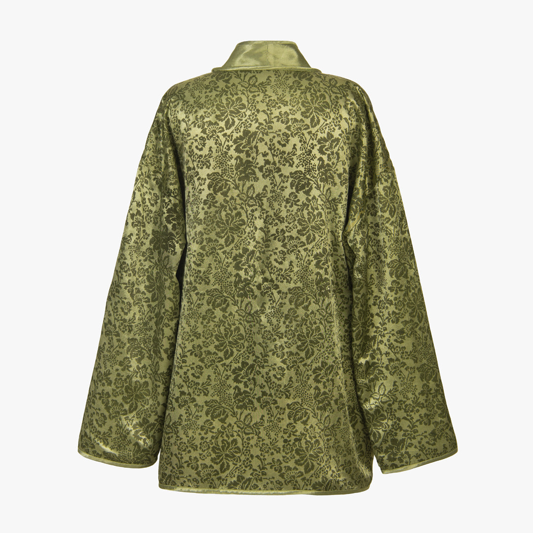 Green patterned coat on a white background