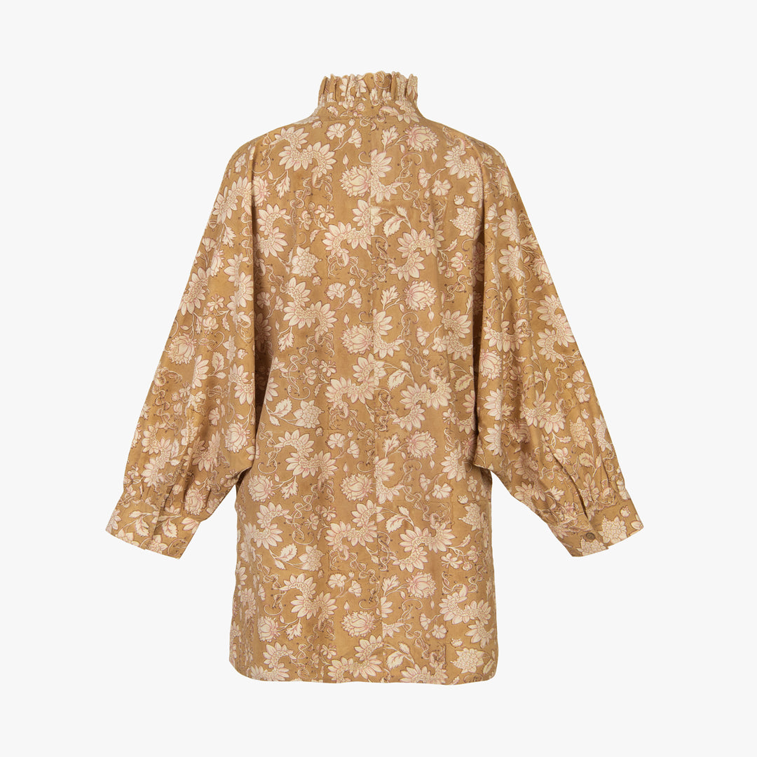 Beige floral patterned shirt on a white background