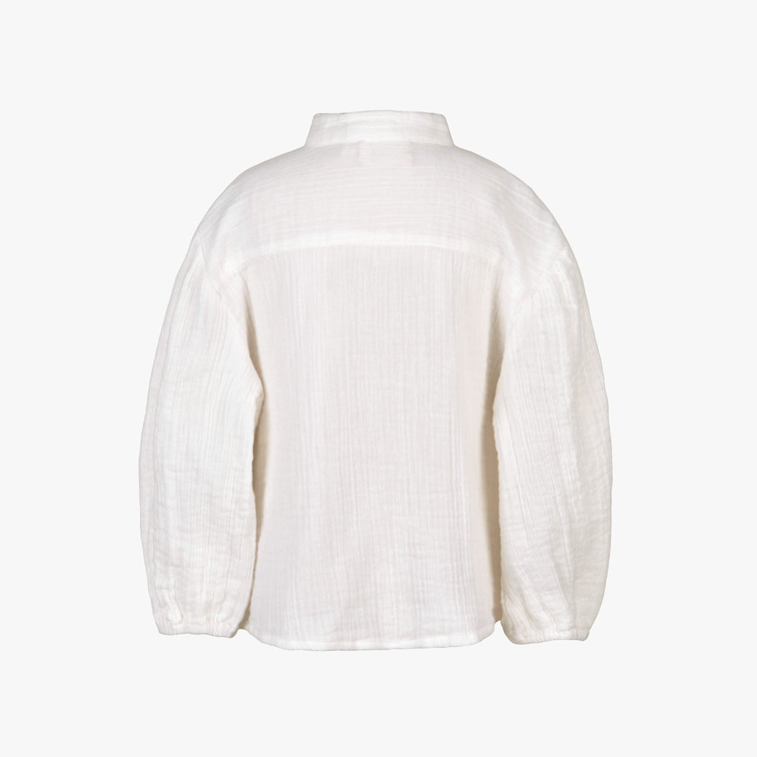 White blouse on a light gray background