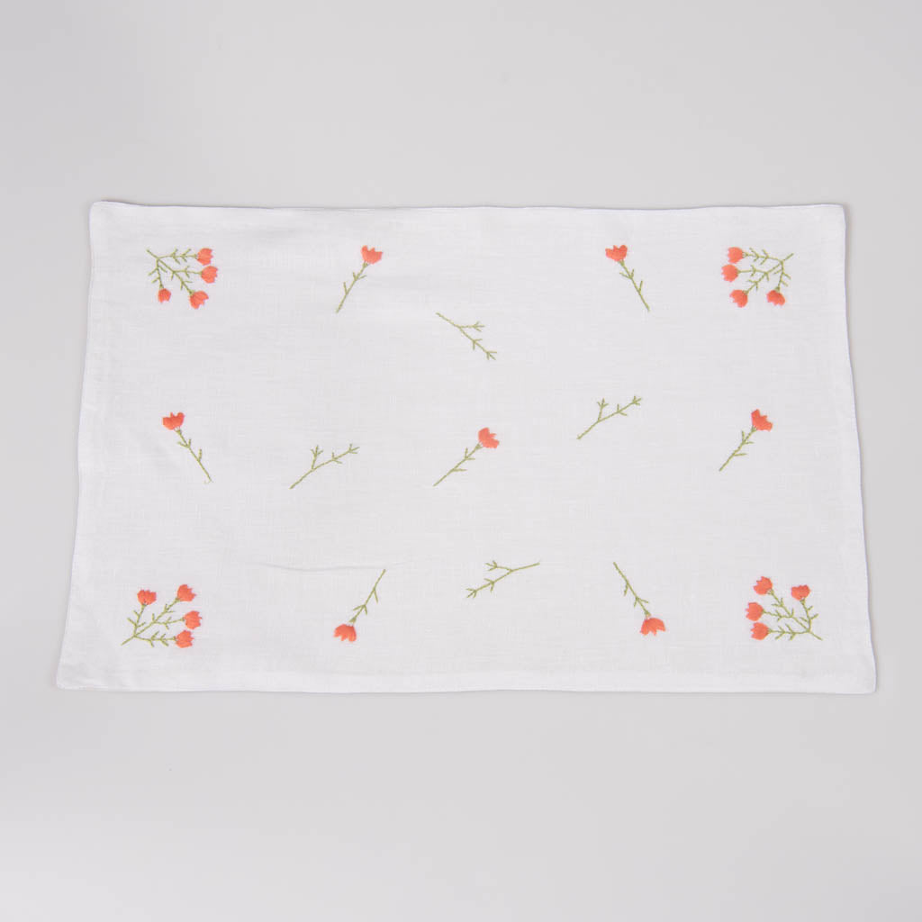 Embroidered white linen table mats