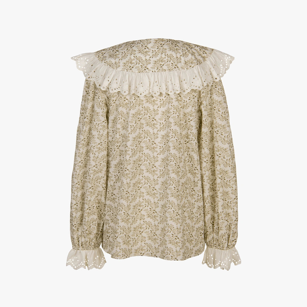 A long-sleeve blouse with a beige and white floral print, featuring a large ruffled lace collar, sheer lace cuffs, and a scalloped lace hem, shown against a plain white background.