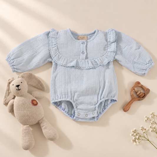 Blue bodysuit with delicate lace detailing and full sleeves.