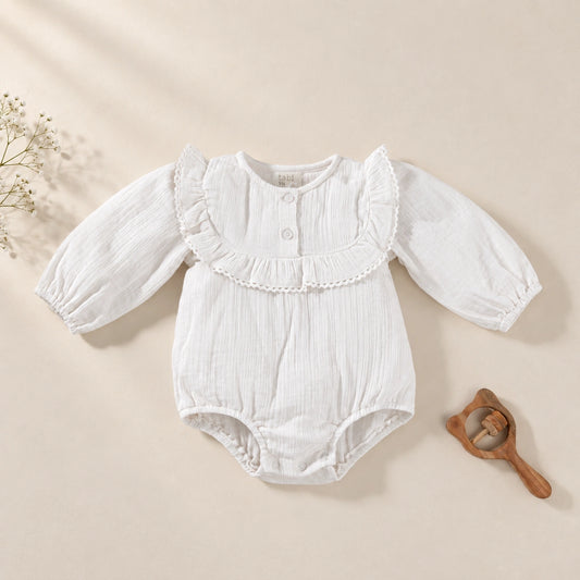 White  bodysuit with delicate lace detailing and full sleeves.