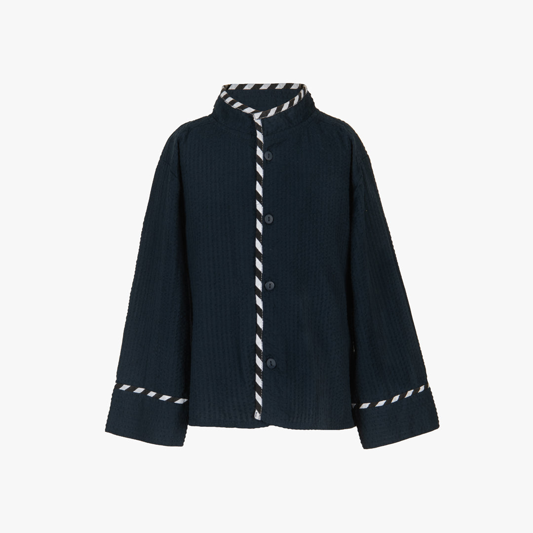 Dark blue ribbed sweater with white striped trim on a white background