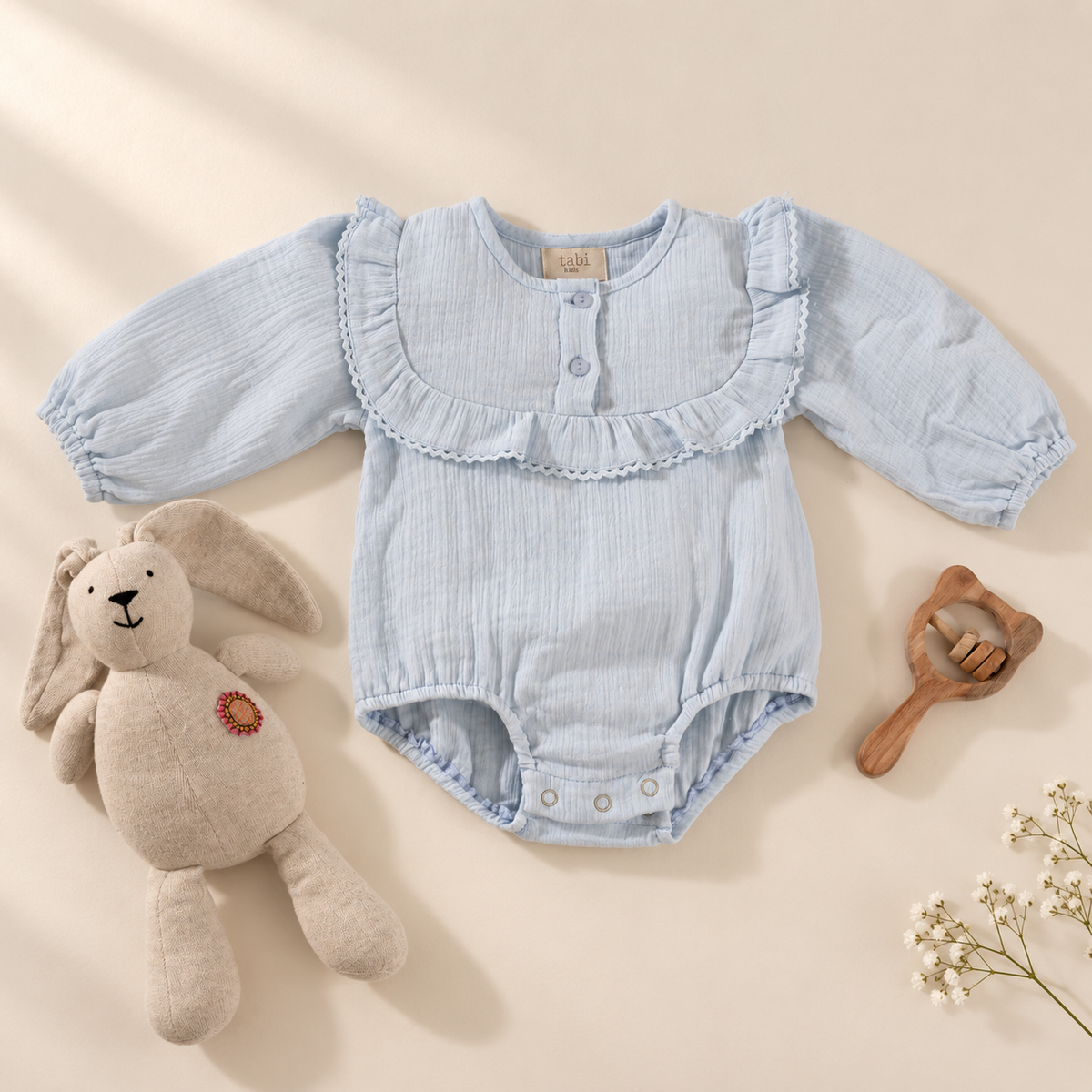 Bodysuits with ruffled collars and lace detailings.