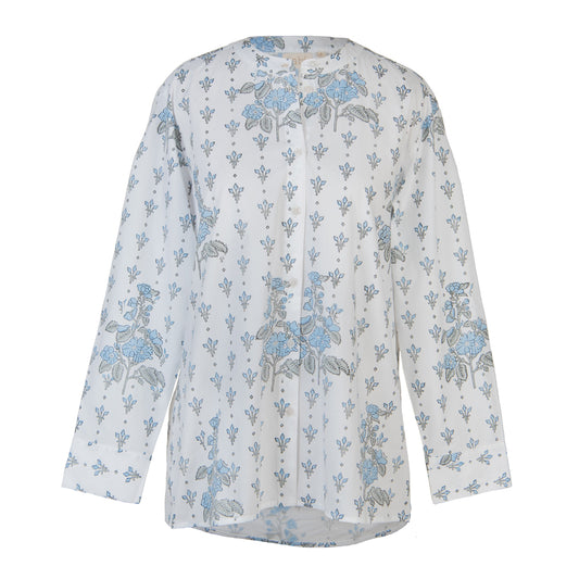 White blouse with blue floral pattern on a white background
