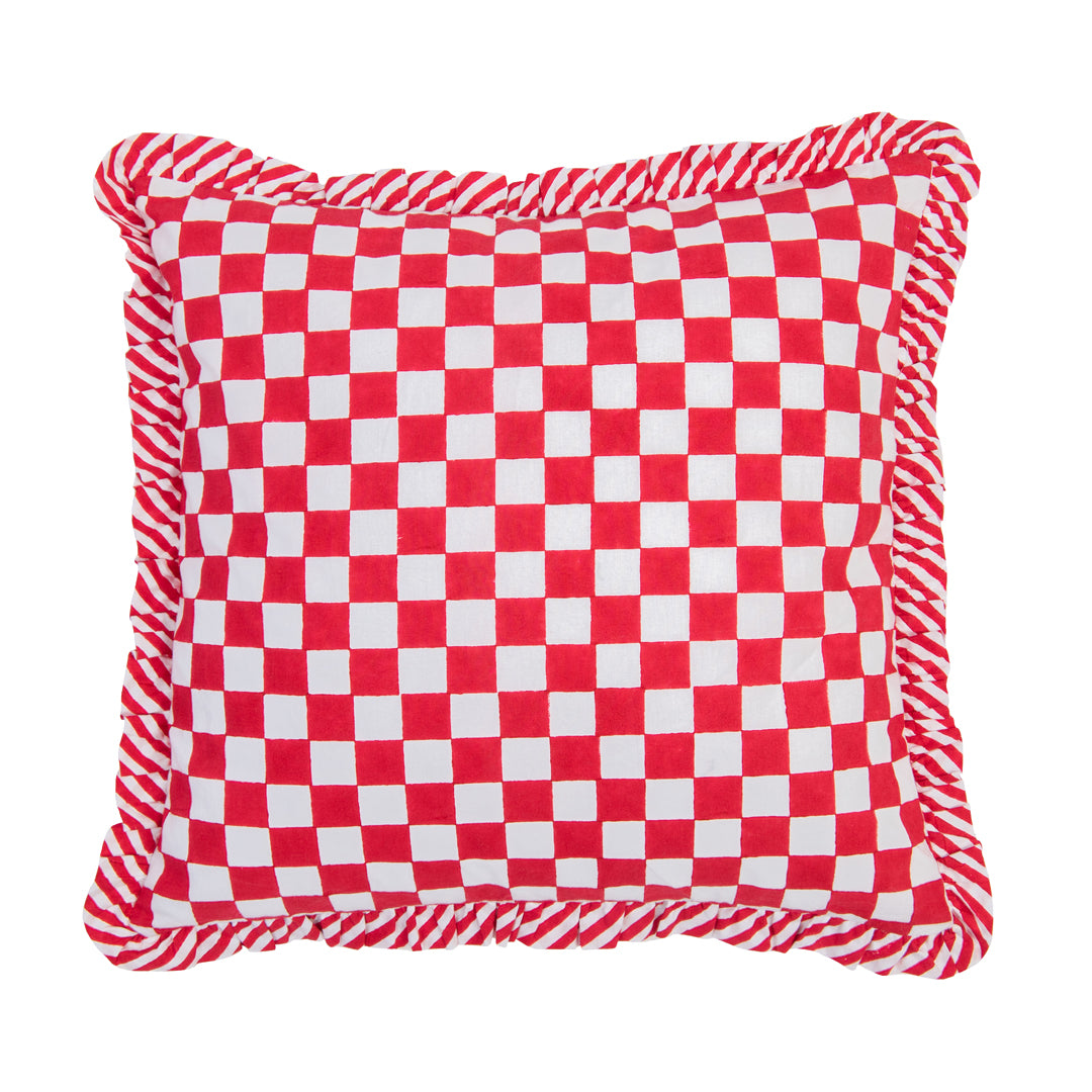 Red and white checkered pillow with frayed edges on a white background