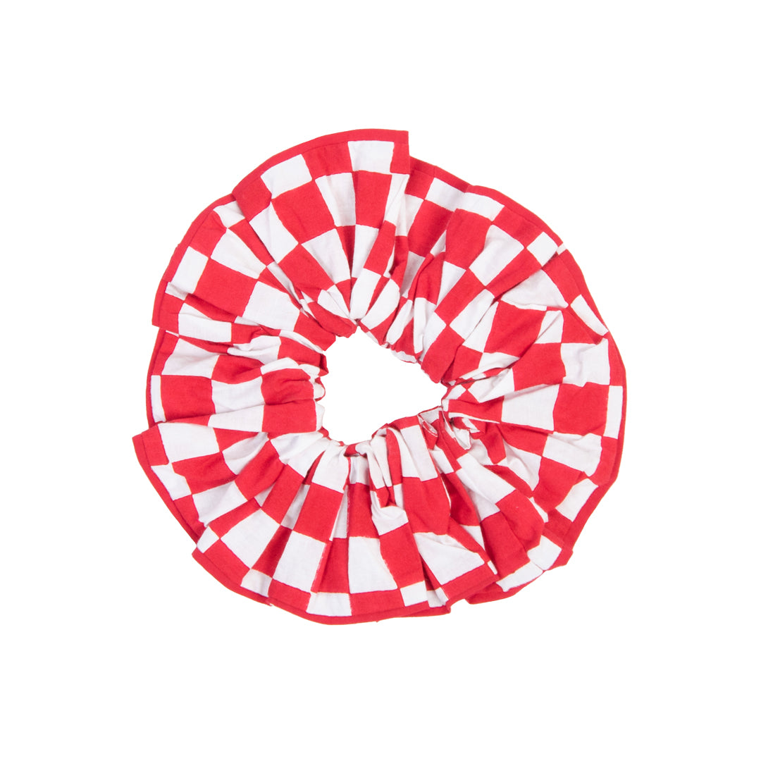 Red and white checkered scrunchie on a white background