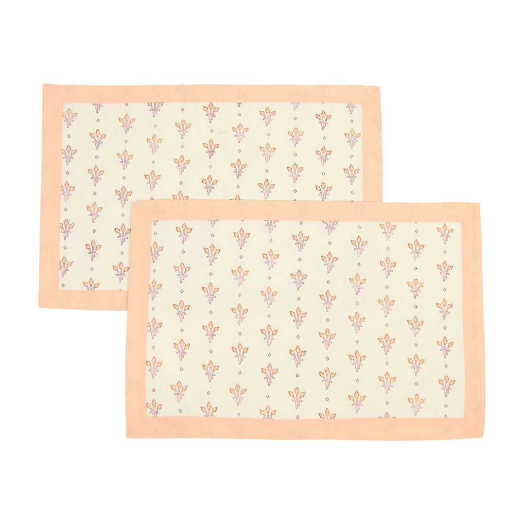 Two rectangular placemats with a floral pattern on a white background