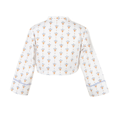 White crop top with floral pattern on a white background