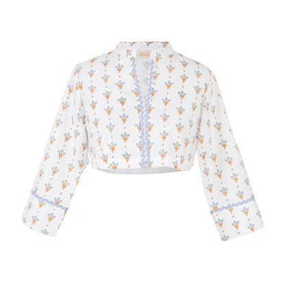 White crop top with floral pattern on a white background