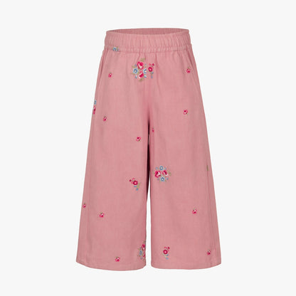Pink wide-leg cropped pants with an elastic waistband and scattered embroidered floral motifs, shown against a plain white background.