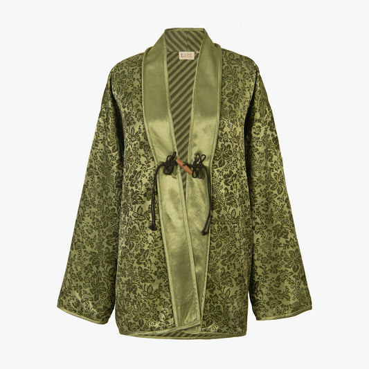 Green patterned jacket with a satin lapel on a white background