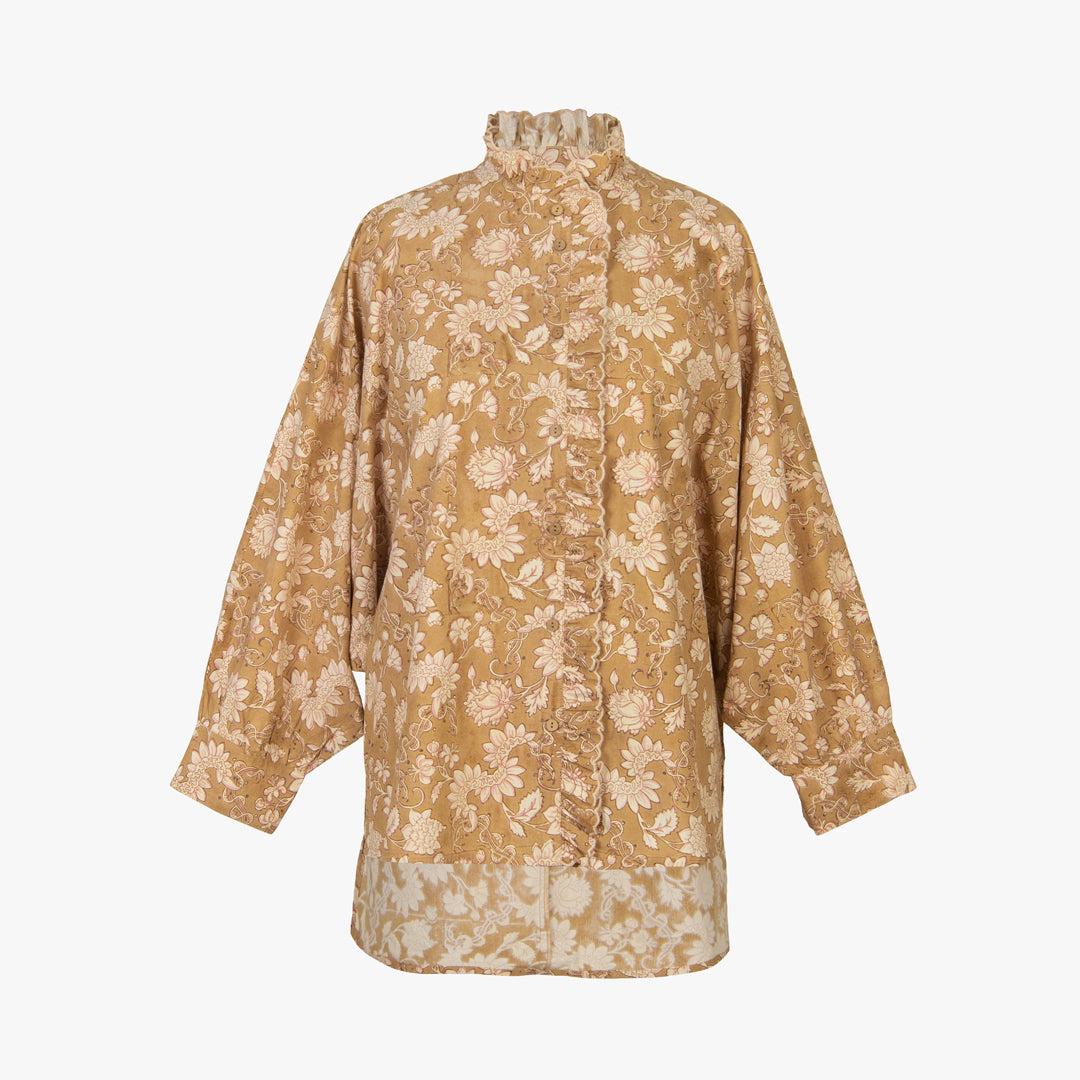 Beige floral patterned blouse on a white background