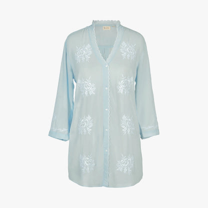 A light blue sheer button-up nightgown or tunic with white floral embroidery, displayed on a clean white background.