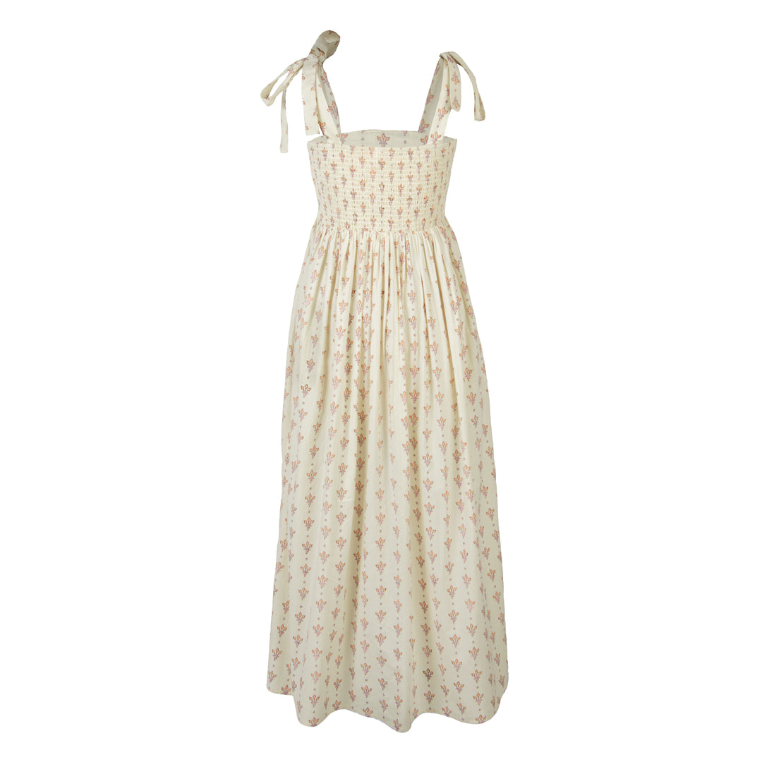 Beige floral dress with thin straps on a white background