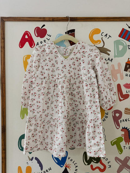 Floral dress hanging on a colorful children's art wall