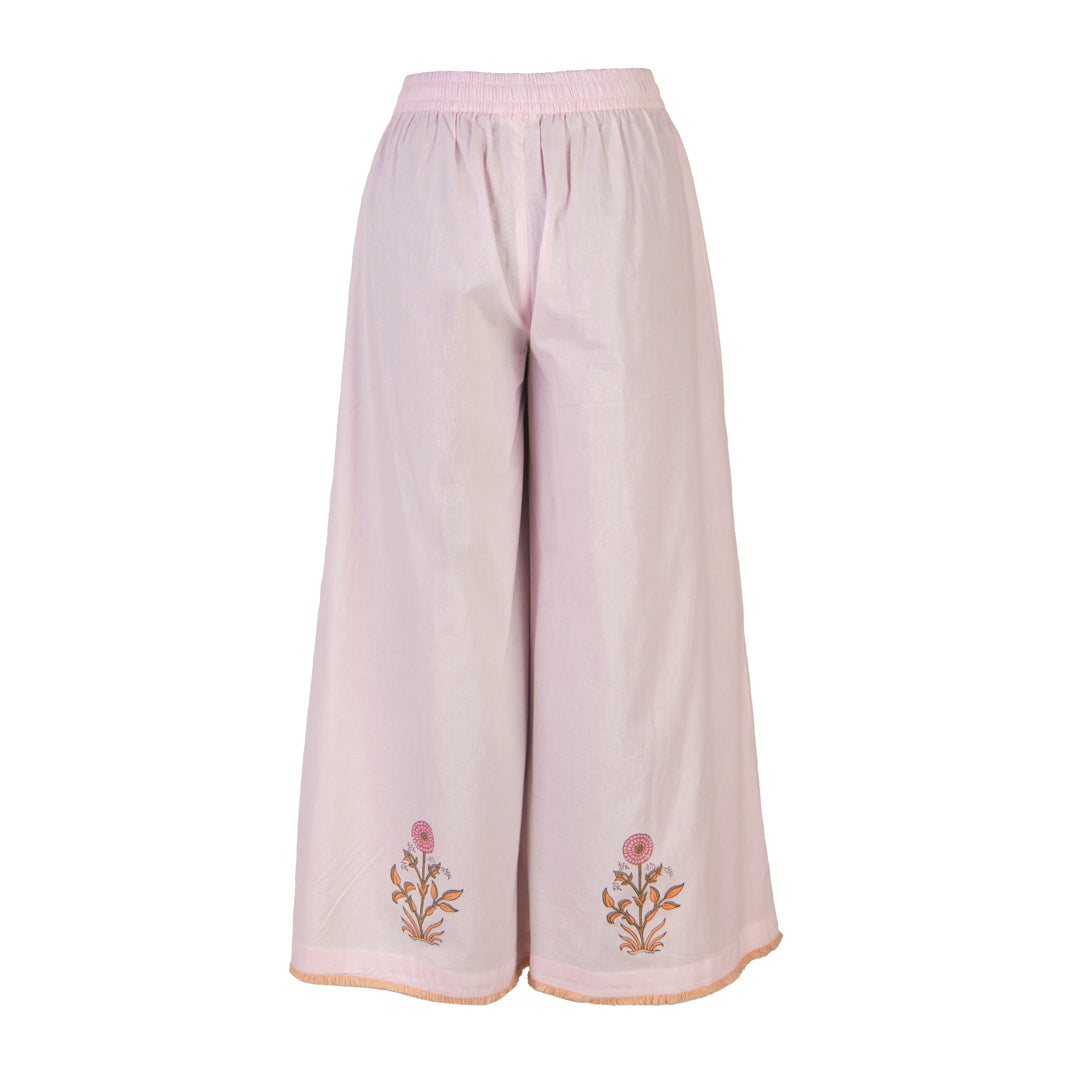 Light pink pants with floral embroidery on a white background