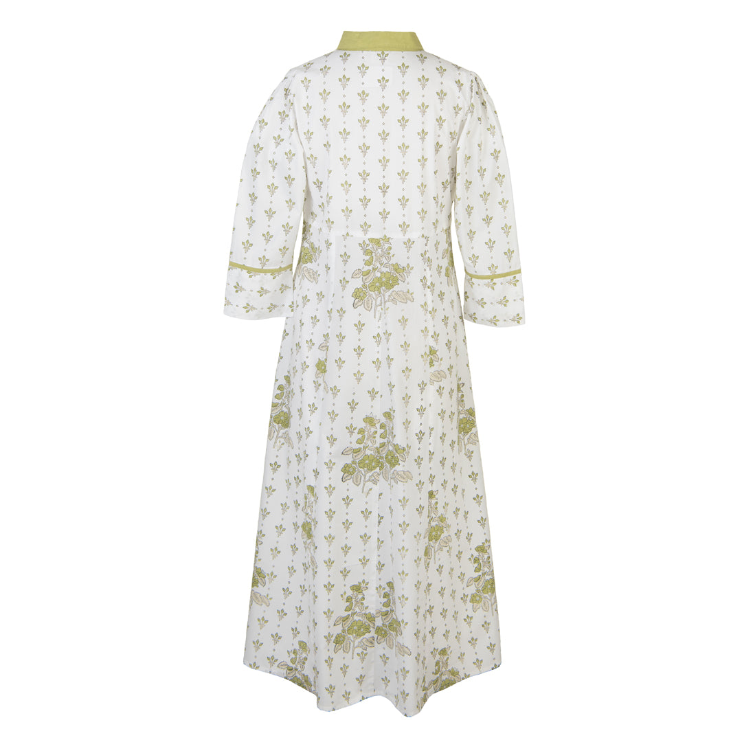 White dress with green floral pattern on a white background