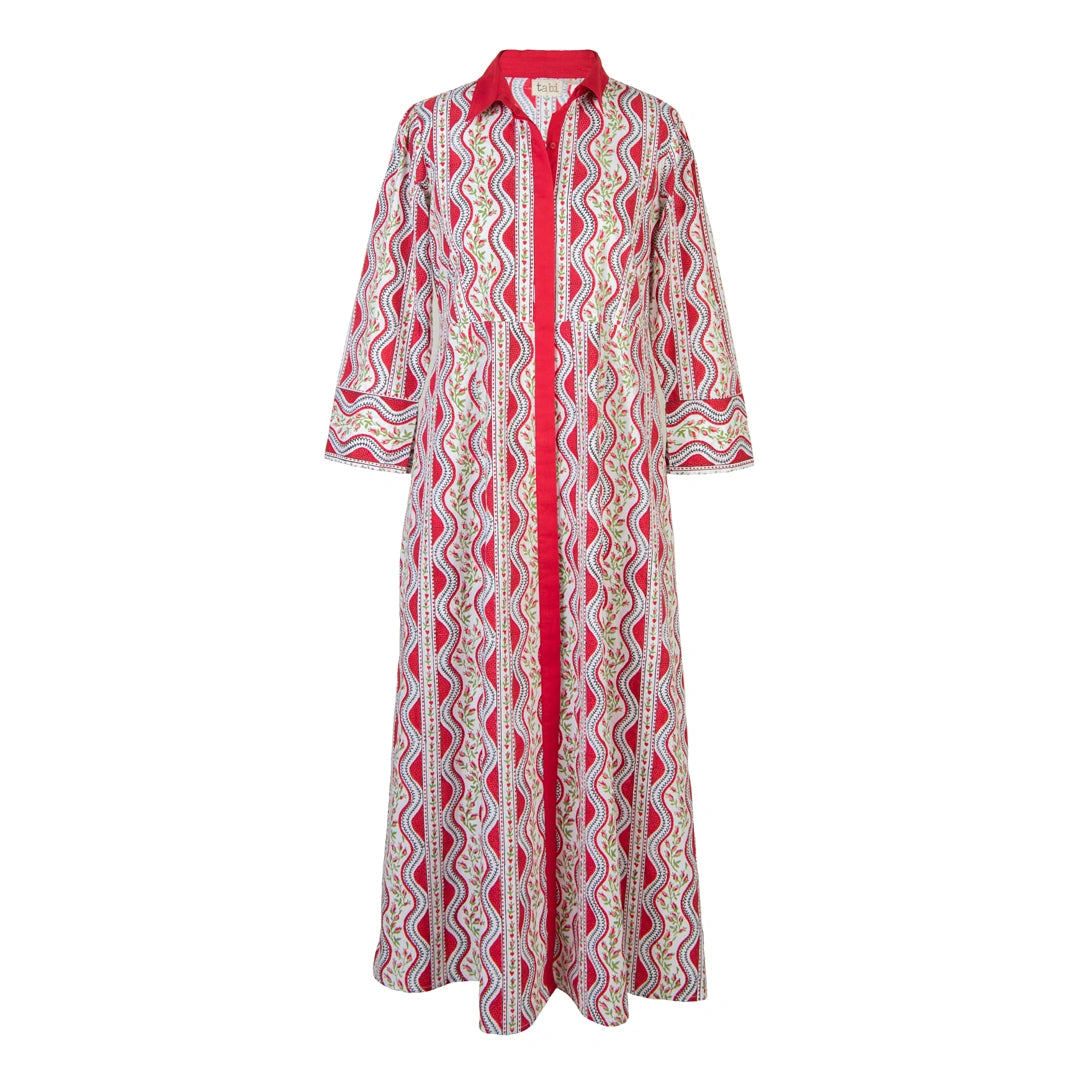A long-sleeved button-up maxi dress with a vibrant red collar, placket, and cuffs, featuring a multicolor wavy geometric pattern in yellow, green, and blue over a cream base.