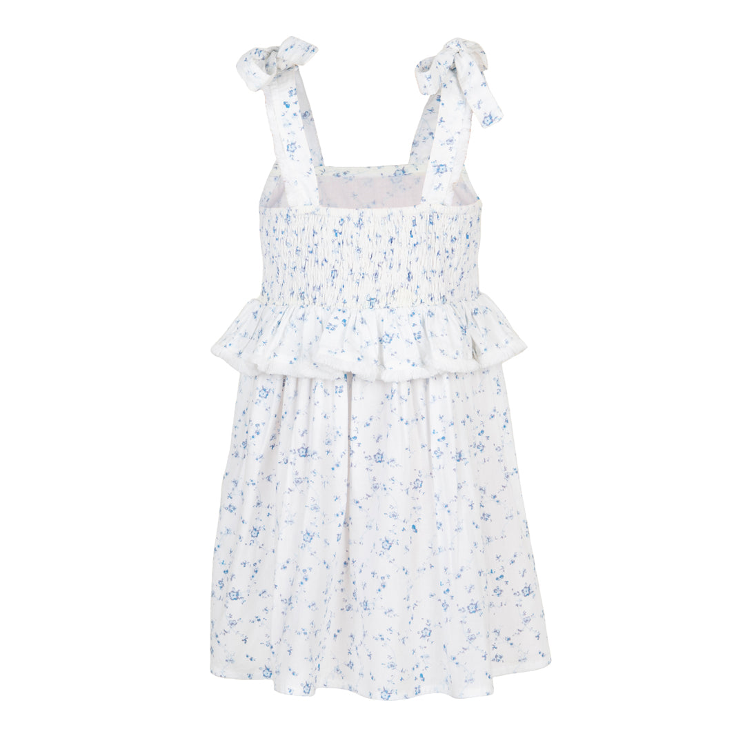 White dress with blue floral pattern on a white background