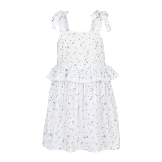 White dress with blue floral pattern on a white background