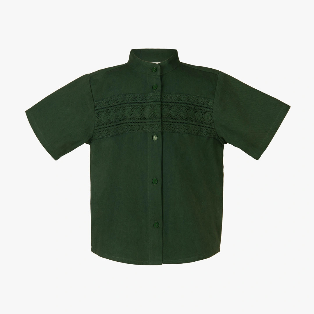 Green short-sleeve shirt with embroidered details on a white background