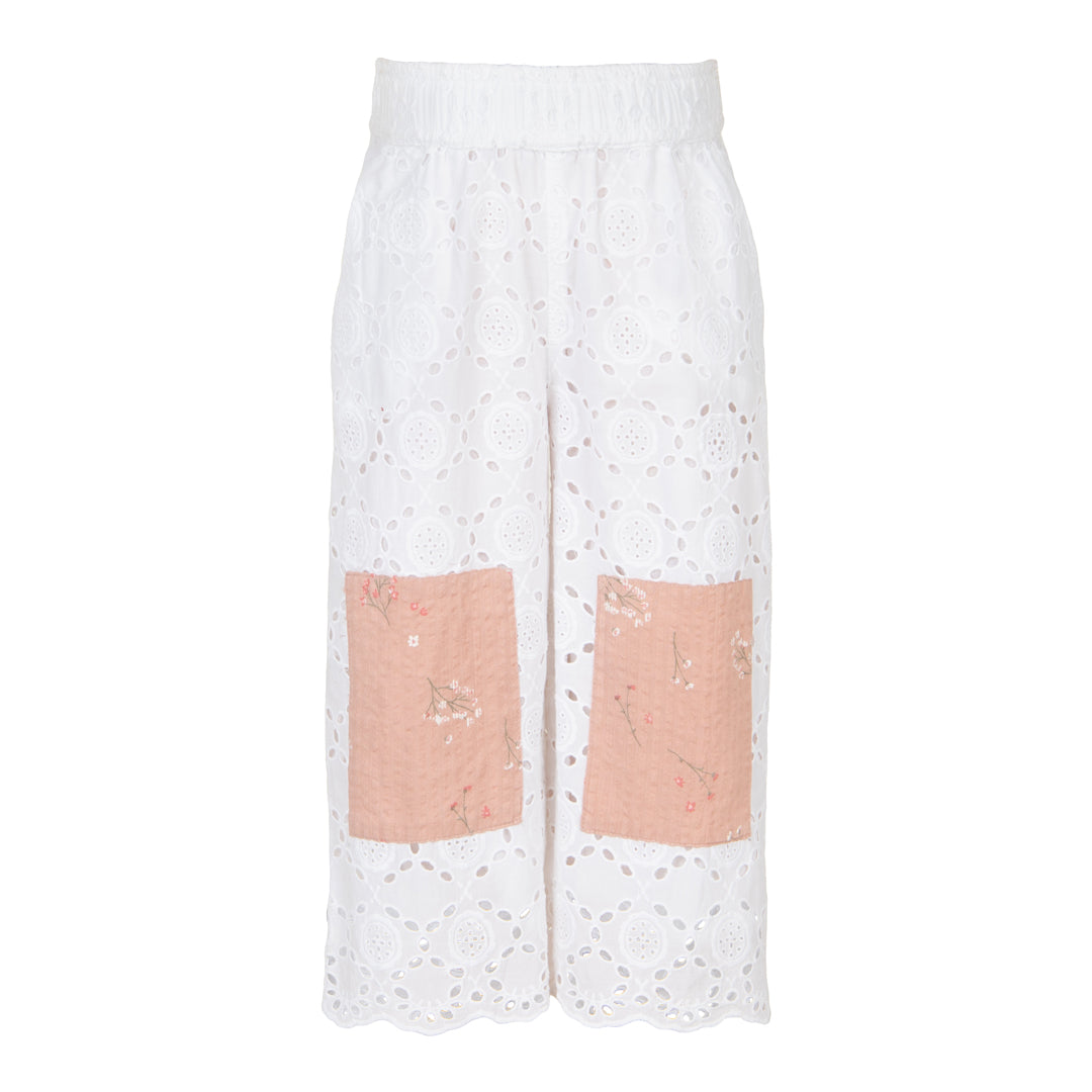 White lace pants with pink patches on a white background