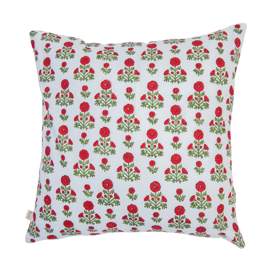 Decorative pillow with red floral pattern on a white background
