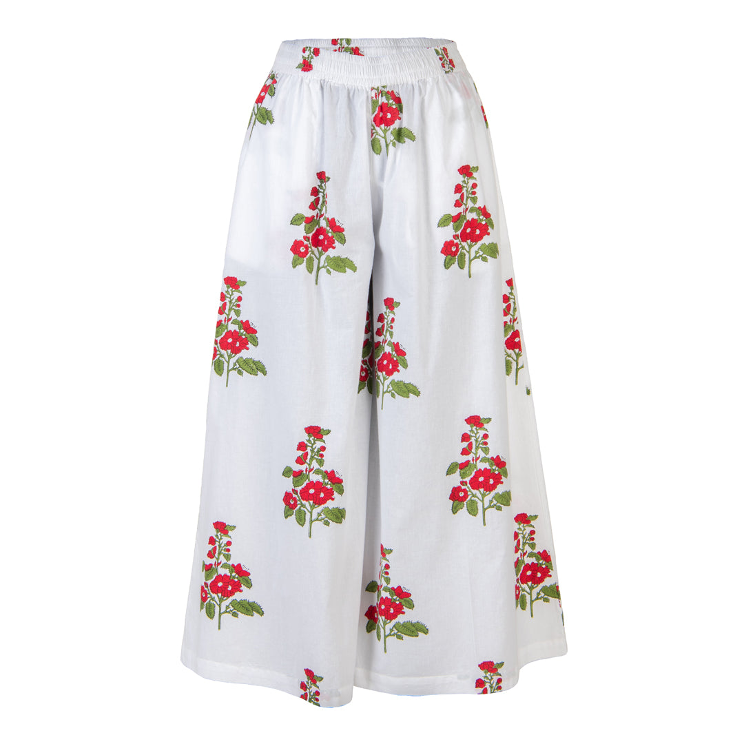 White pants with red floral patterns on a white background