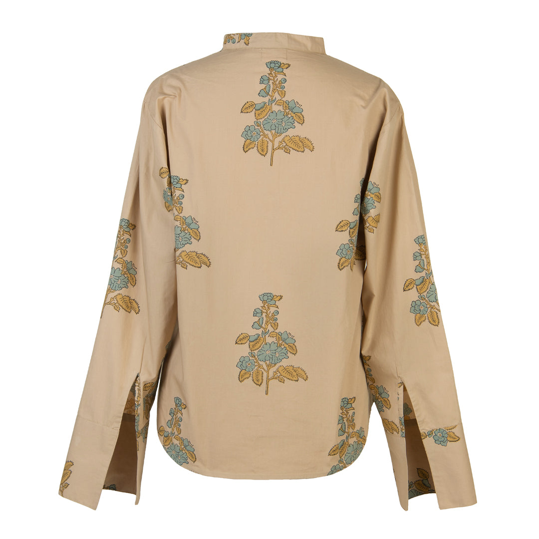 Beige shirt with floral embroidery on a white background