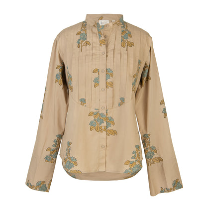 Beige blouse with floral patterns on a white background