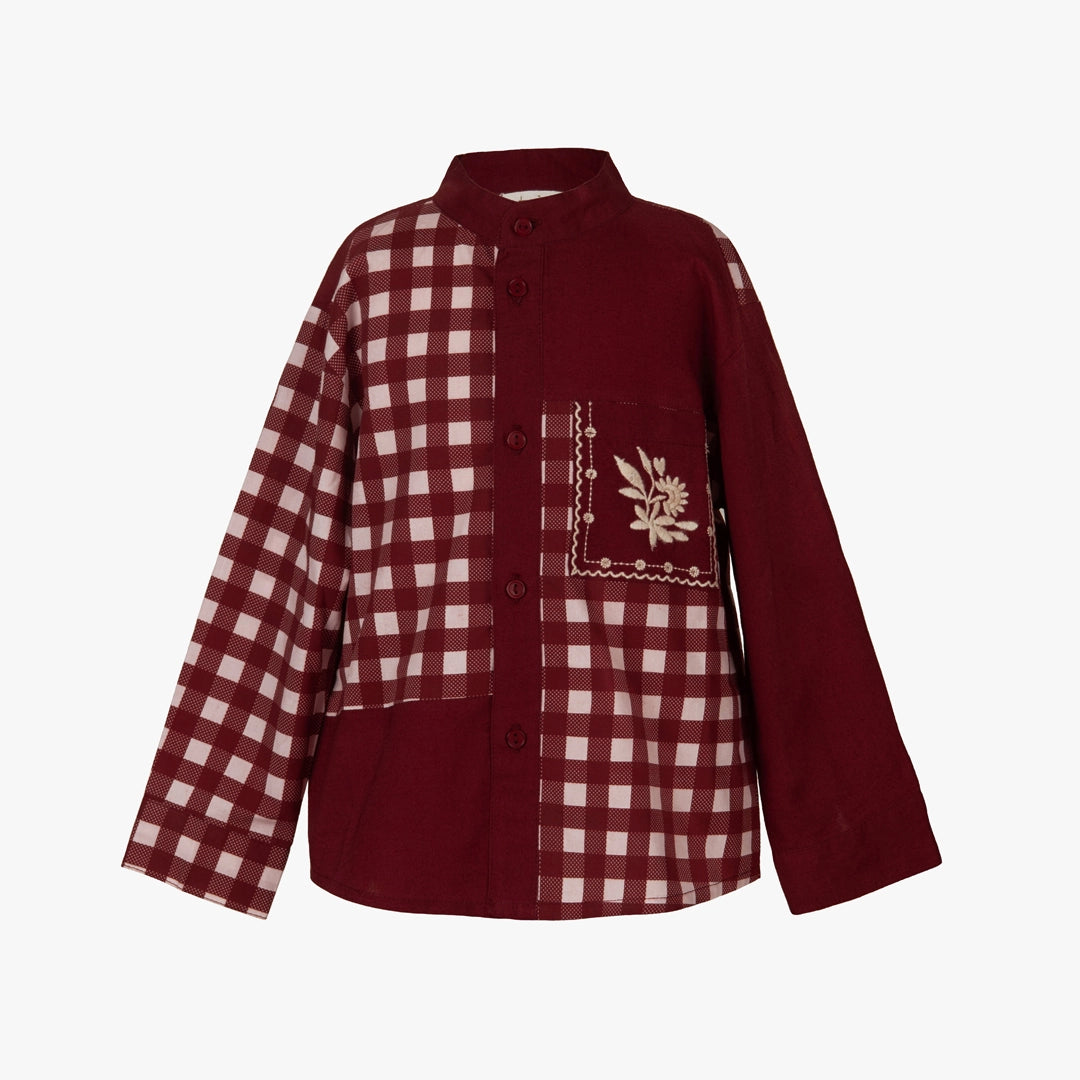 Maroon and white checkered shirt with floral embroidery on a white background