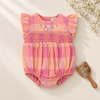 Pink bodysuit features beautiful floral hand embroidery, playful ruffle sleeves and delicate smocking for a sweet, timeless touch. 