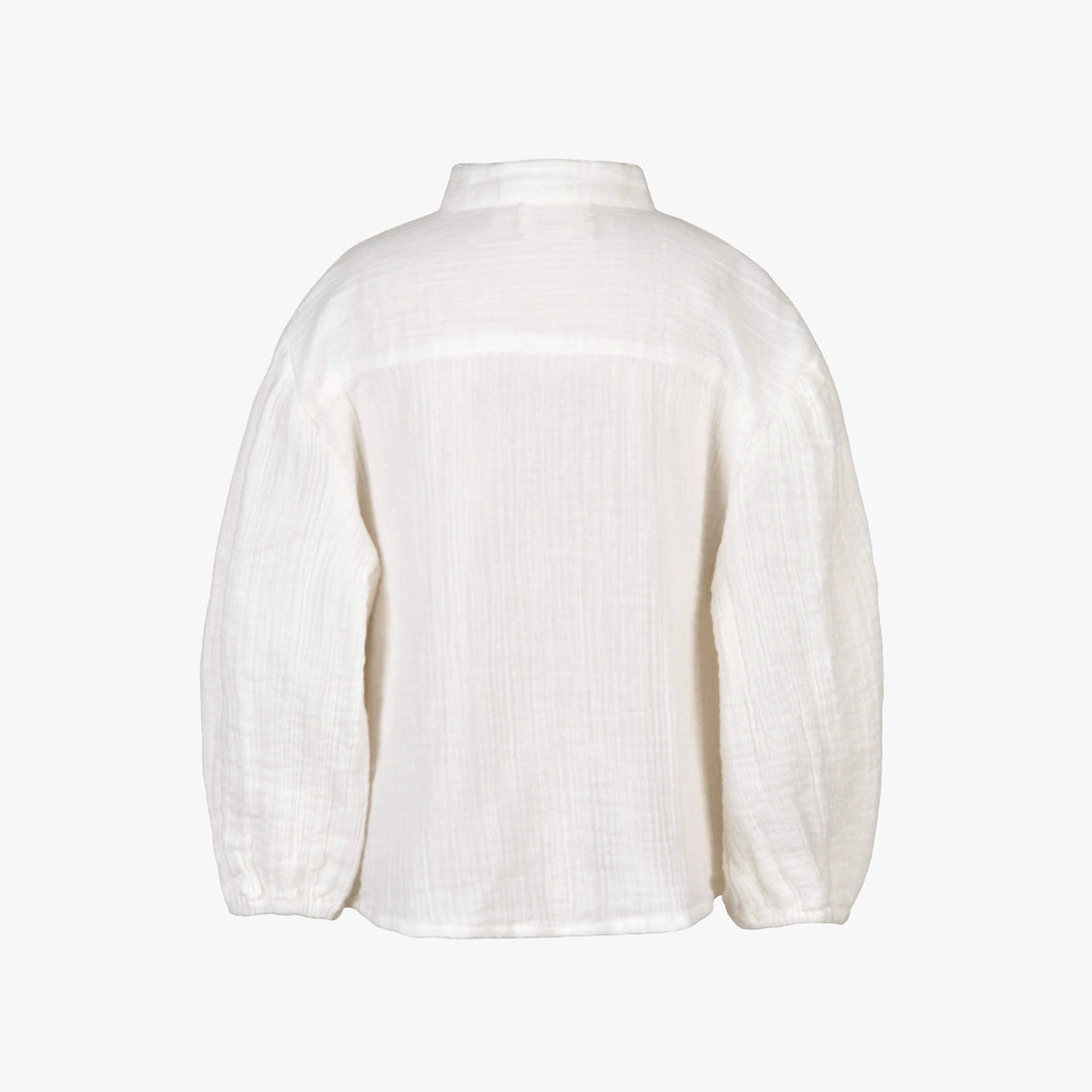 White blouse on a light gray background