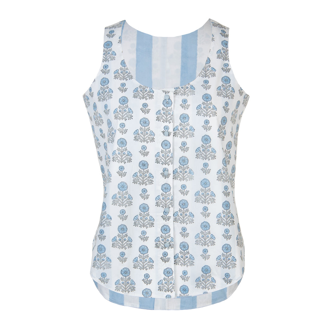 White sleeveless top with blue floral pattern on a white background