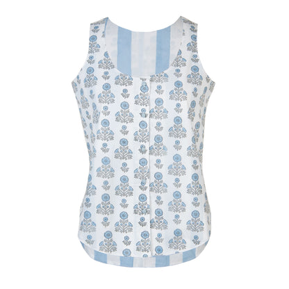 White sleeveless top with blue floral pattern on a white background