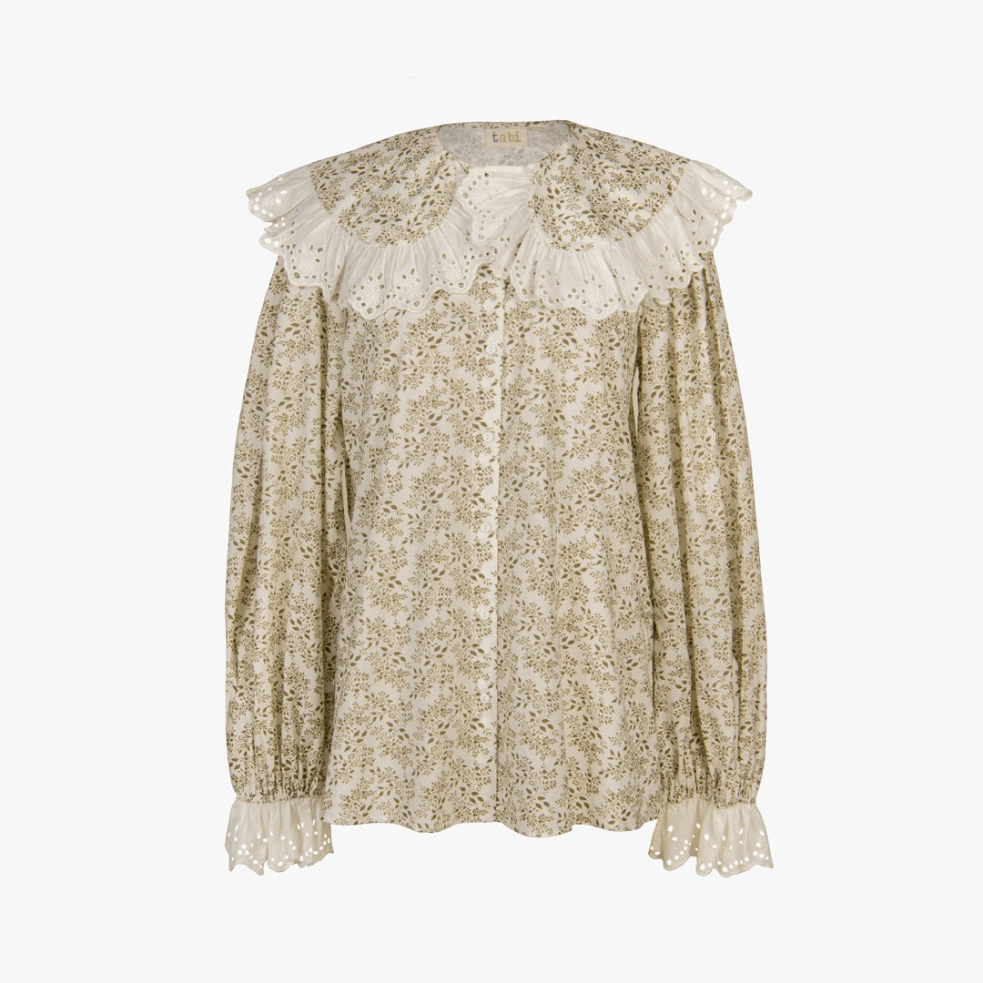 A long-sleeve blouse with a beige and white floral pattern, featuring a large ruffled eyelet collar and matching ruffled cuffs, shown against a plain white background.