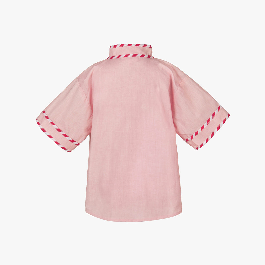 Pink kimono-style garment with red trim 