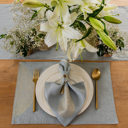 Mokotua gold foil printed table linen set aqua grey