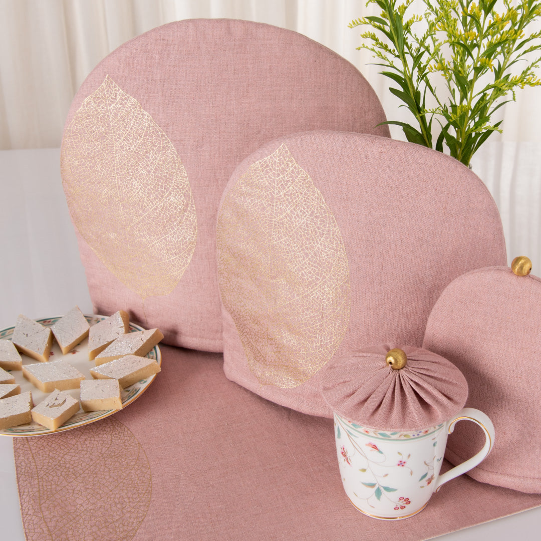 Dusty rose linen tray mat, tea cosy and glass cover