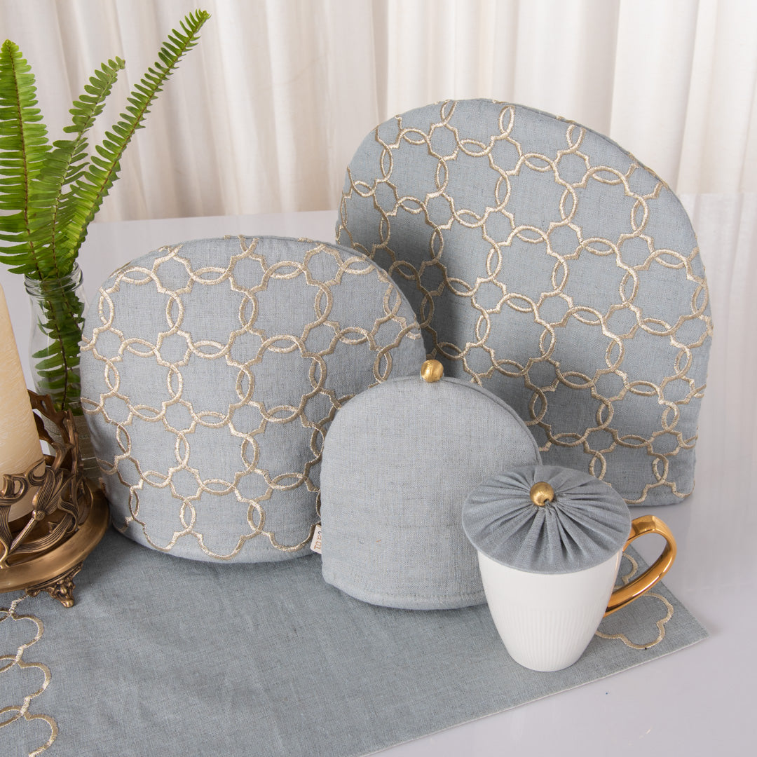 Aqua grey linen tray mat, tea cosy, milk cosy and glass cover