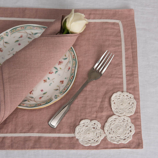 Dusty rose linen table mats with crochet detailing