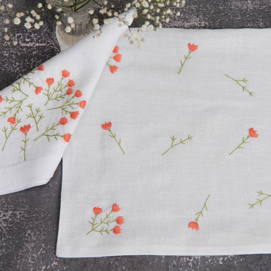 Embroidered white linen table mats