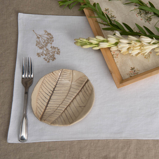 Embroidered white linen table mats