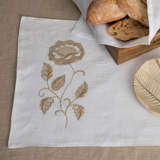 Embroidered white linen table mats